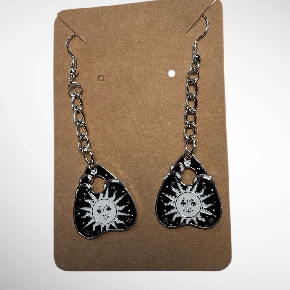 NWOT- earrings Sun/Moon silver tone, white/enamel on a black planchette design